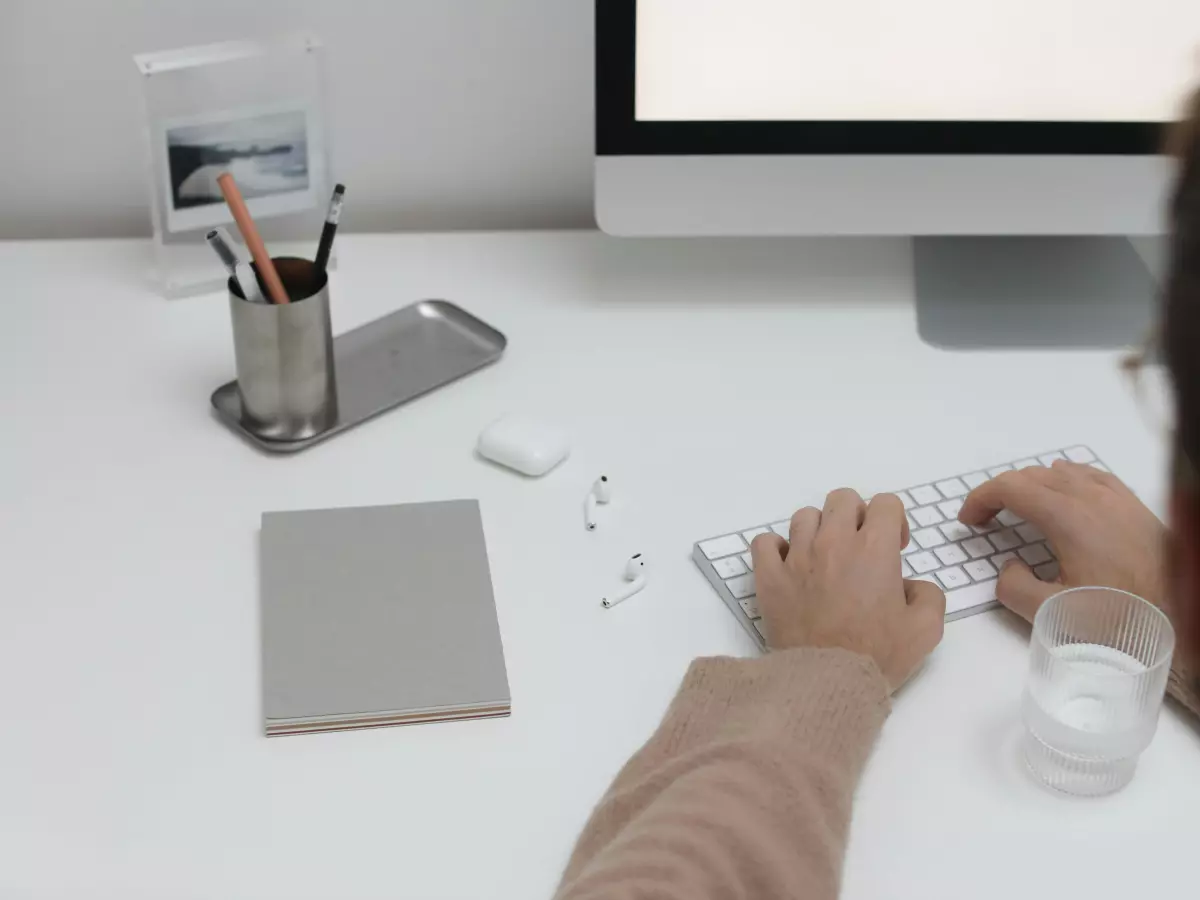 A person working on a computer in a home office