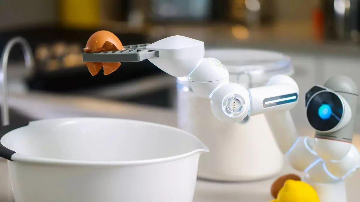 A white humanoid robot arm is picking up a brown egg with its robotic pincers. The robot is standing in a kitchen, with a bowl, a container of flour, and other kitchen items in the background.