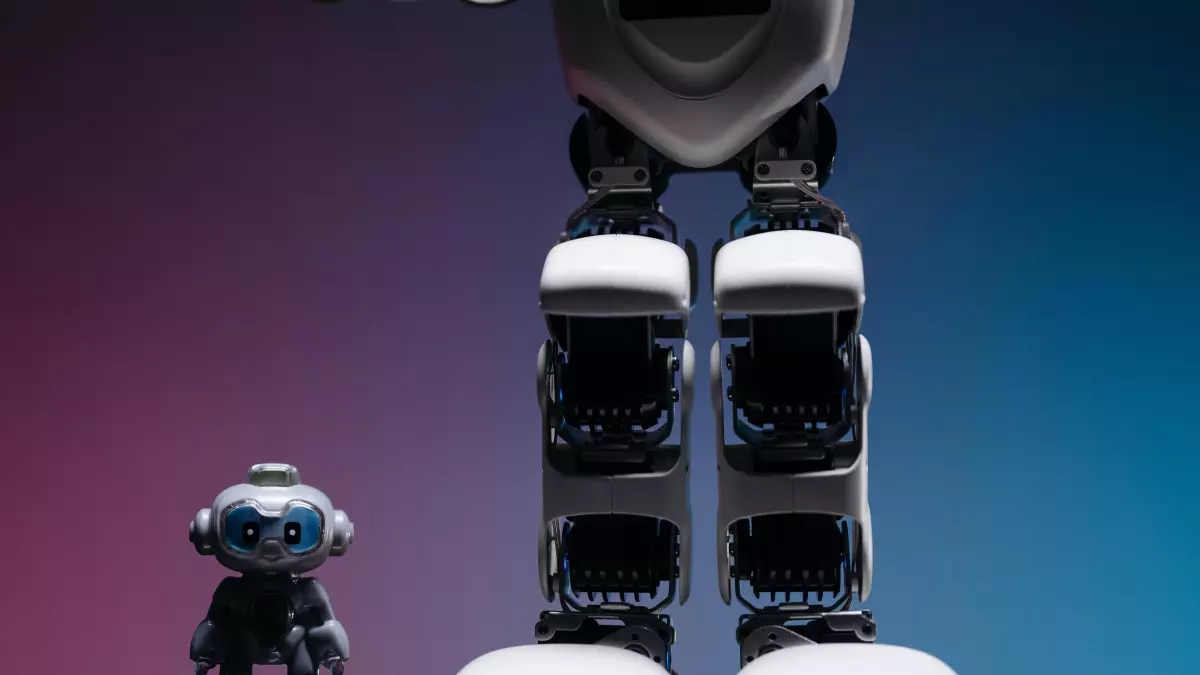 A white humanoid robot with black accents stands tall, its legs and feet prominently displayed.  A smaller humanoid robot, facing the viewer, stands at the base of the larger robot