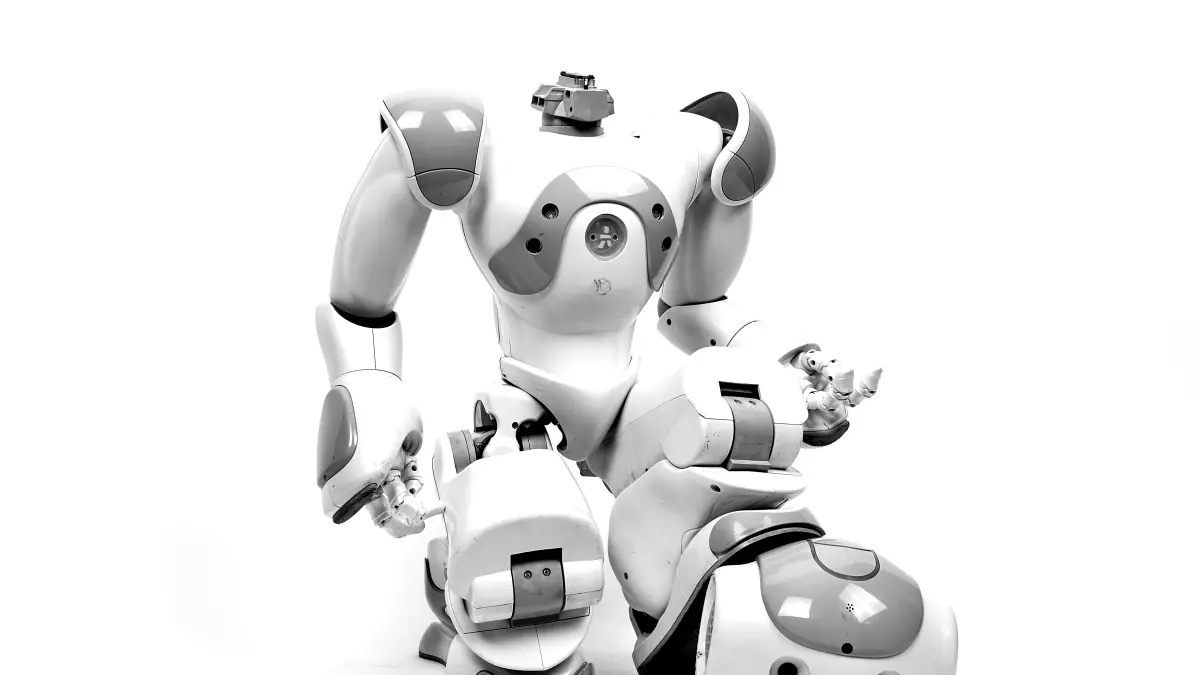 A disassembled humanoid robot in a white background, showing its inner workings and joints.