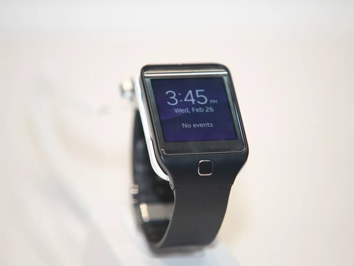 A smartwatch with a black band and a silver case.