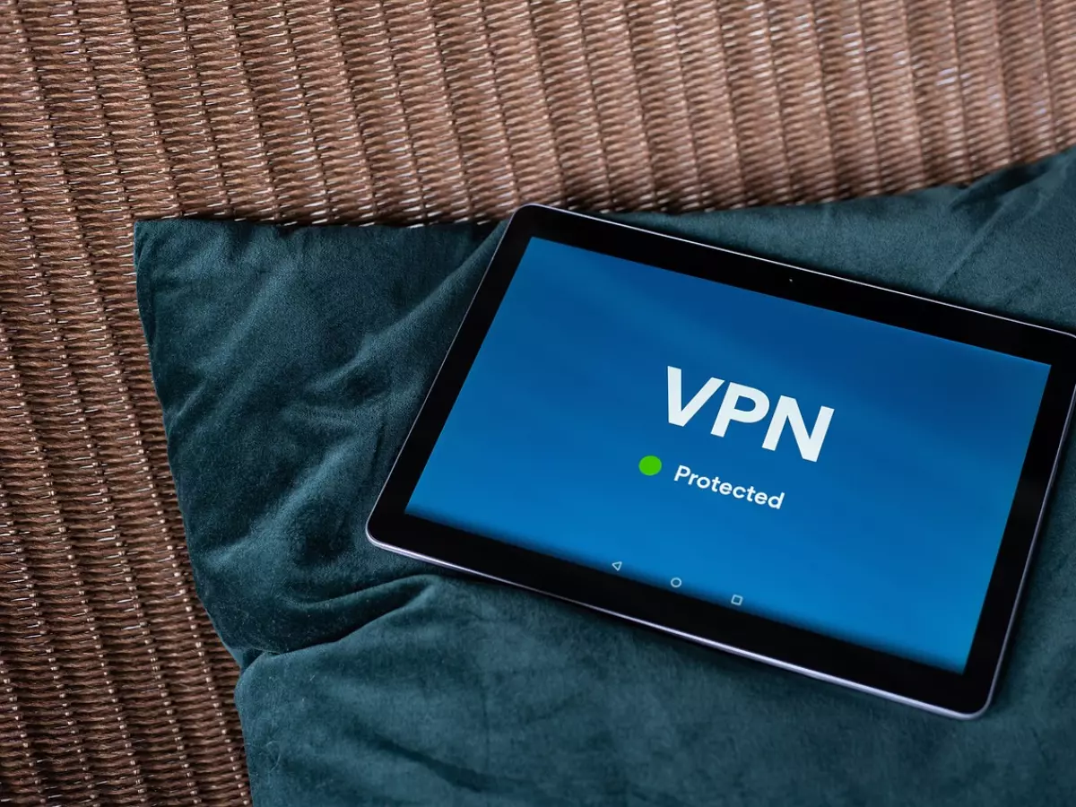 A tablet with a VPN screen on it, showing a green protected symbol.