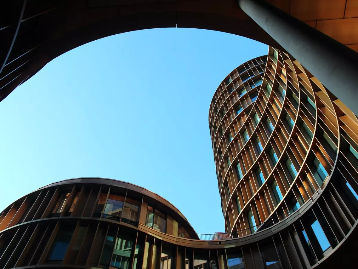 A modern building with a curved facade and large windows.