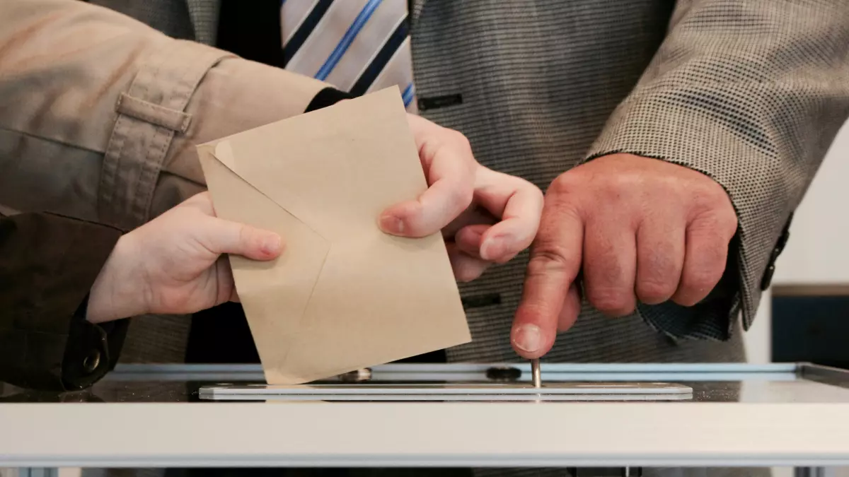 A person casting a vote in an election