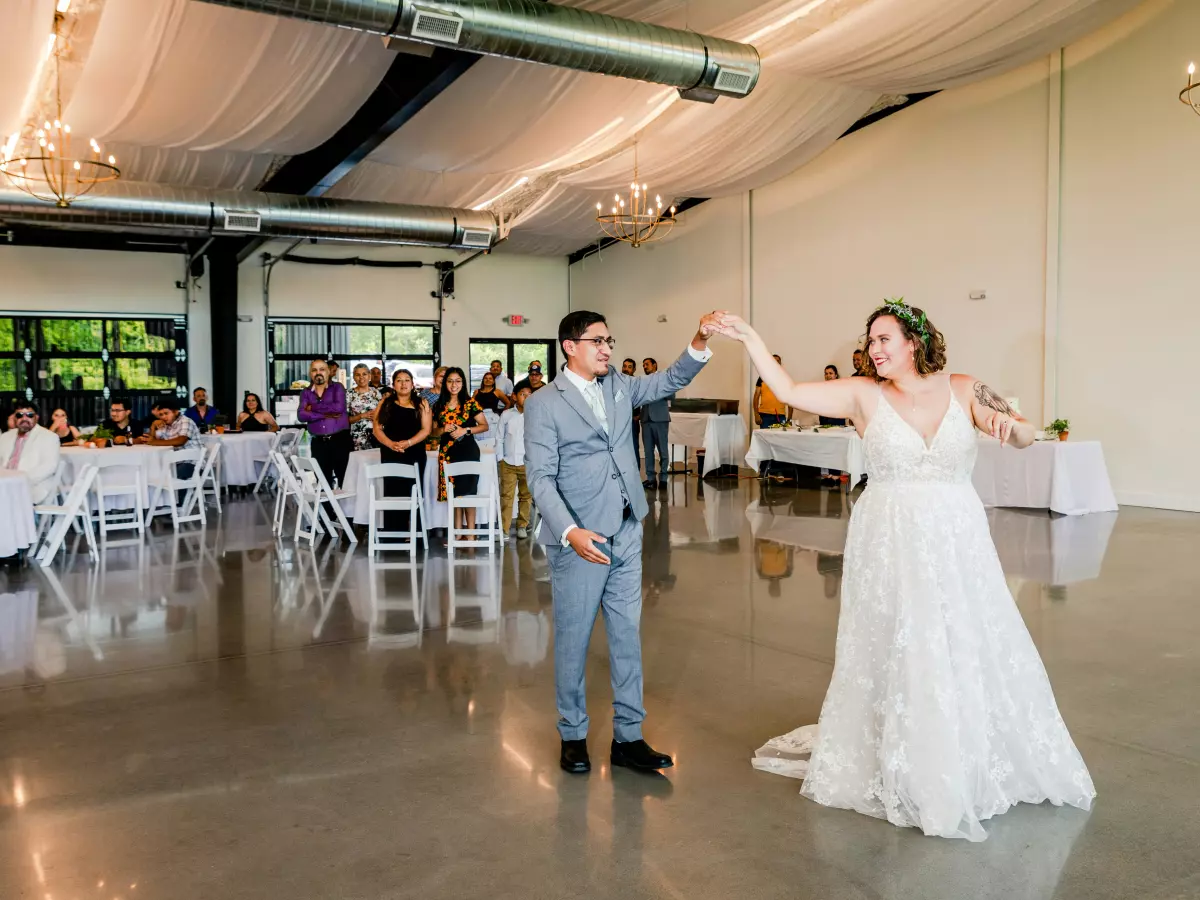 A bride and groom dance at their wedding reception