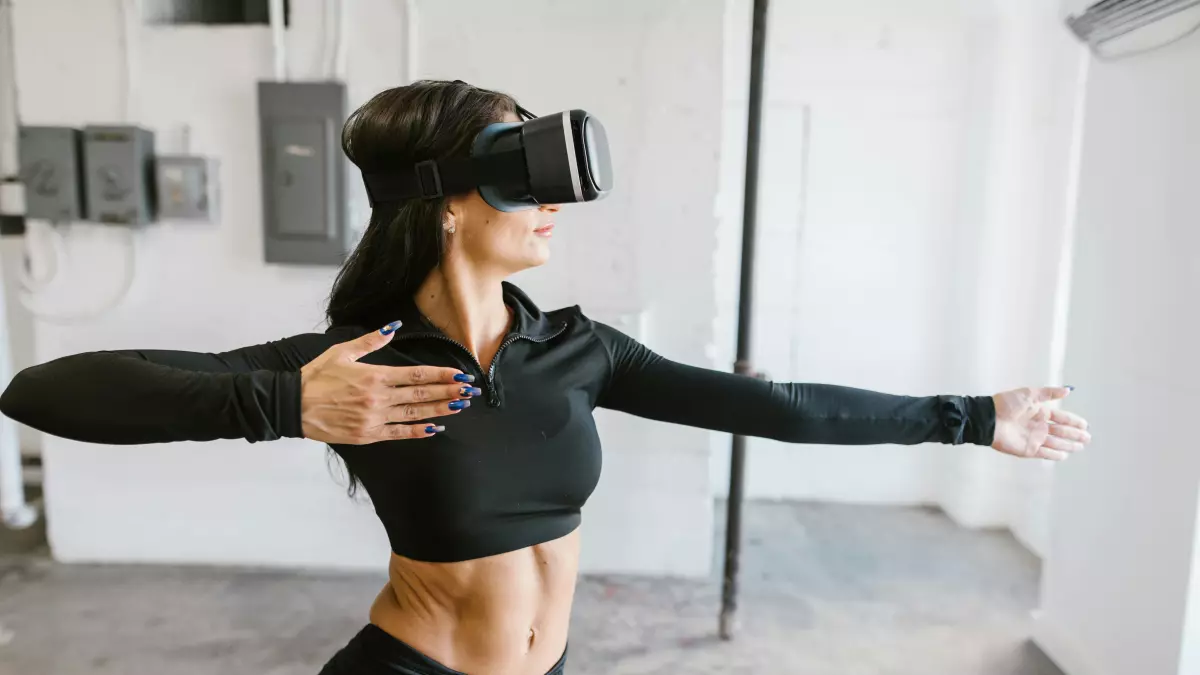 A woman using a VR headset, appearing to participate in a virtual activity.