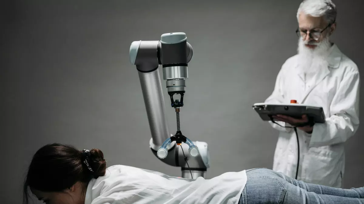 A robotic arm is performing a medical procedure on a patient lying on a table. A doctor is standing next to the table and looking at the robot.