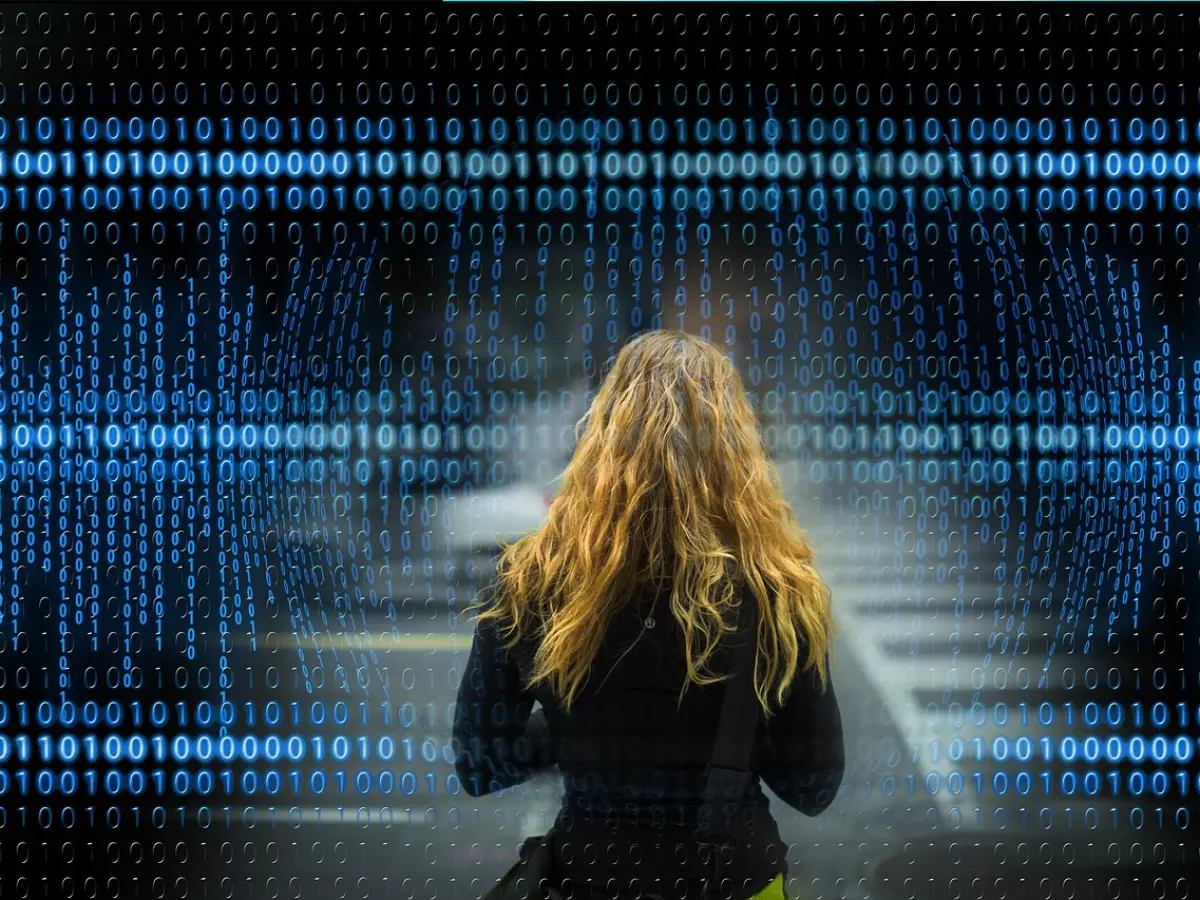 A woman is walking away from the camera while a digital data pattern is in the foreground.