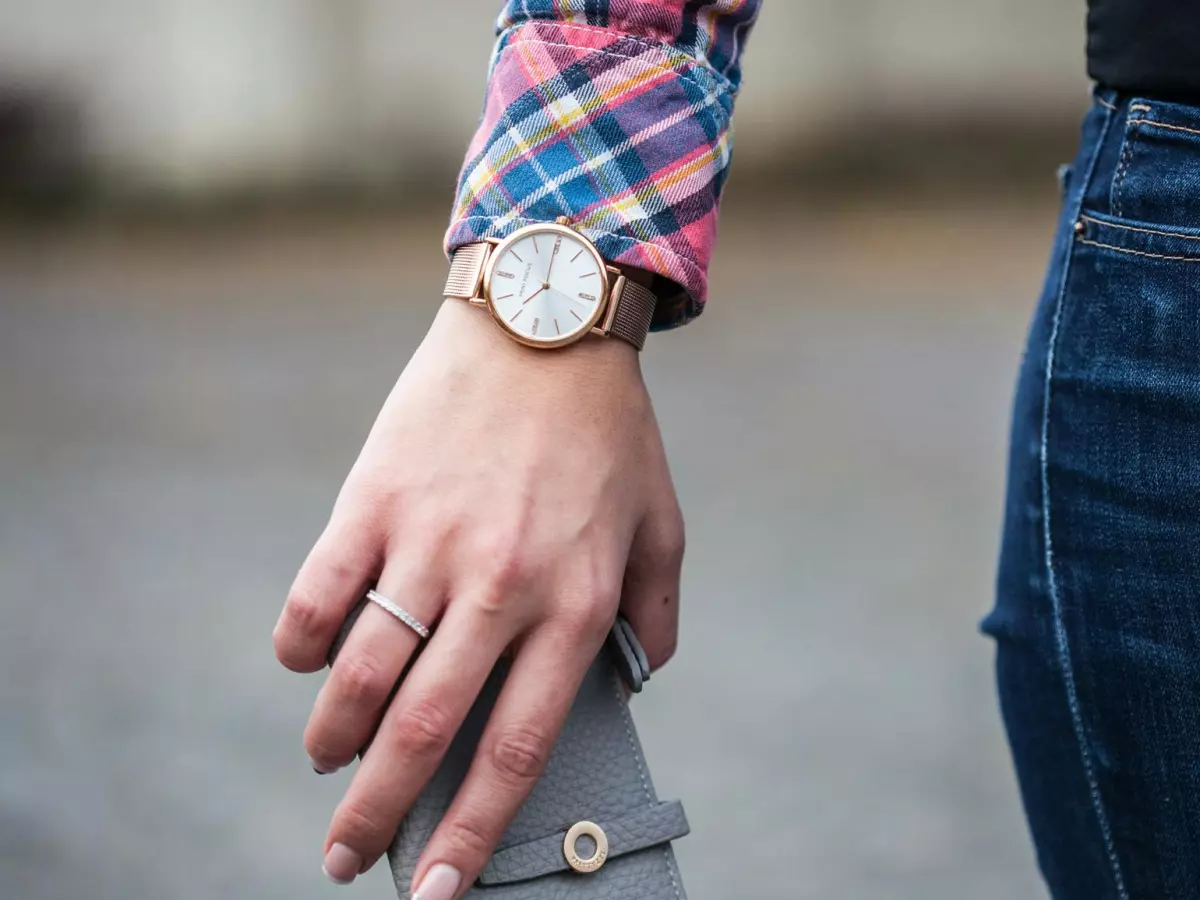 A person wearing a watch on their wrist.