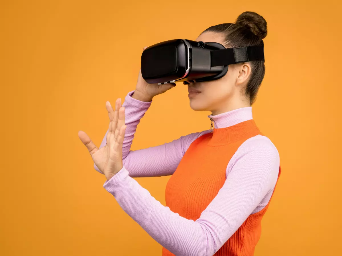 A person using a VR headset interacts with the digital world. 