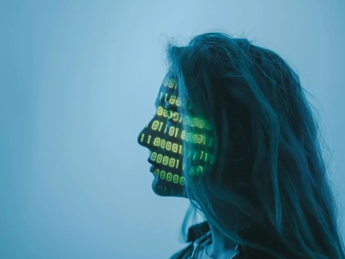 A woman's face is partially obscured by a digital pattern of binary code, creating a mysterious and futuristic effect.